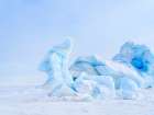 Iceberg in the frozen Mohnbukta in Sabine-Land. Spitzbergen in the Svalbard. Scandinavia, Norway. Art Print